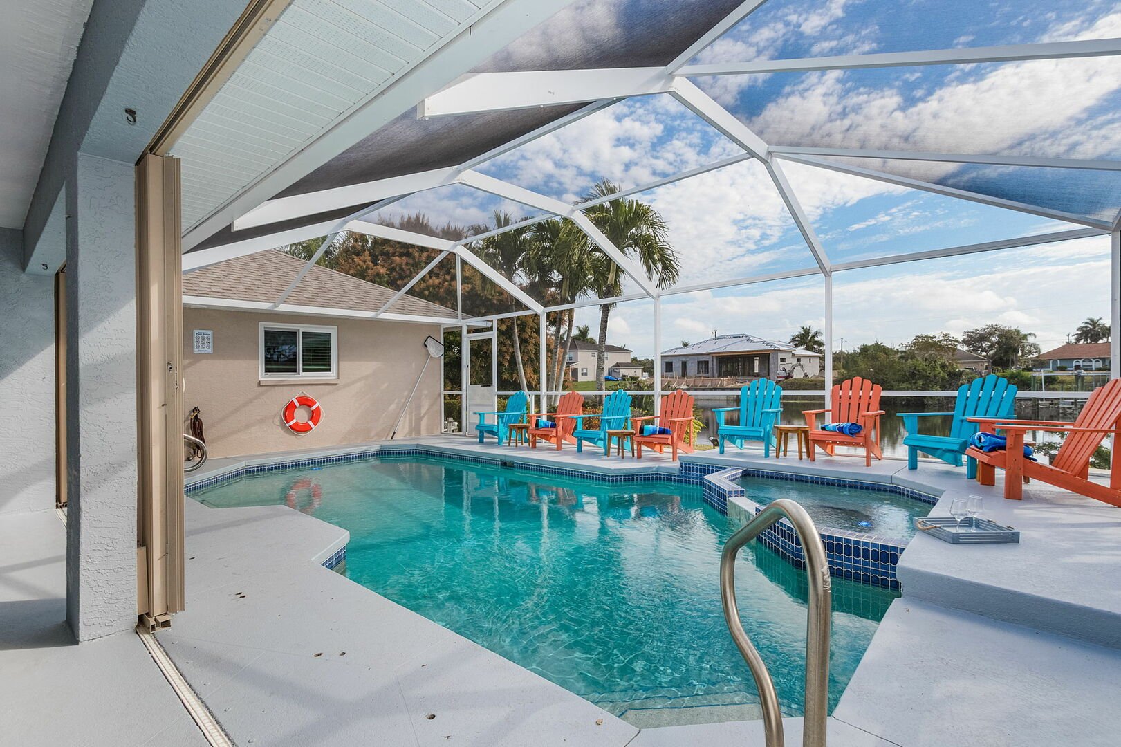 HEATED POOL AND HOT TUB/SPA
(a year-long heated private pool and hot tub/spa, fully enclosed with a pool cage, 65