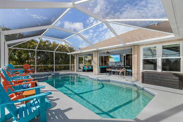 HEATED POOL AND HOT TUB/SPA
(a year-long heated private pool and hot tub/spa, fully enclosed with a pool cage, 65