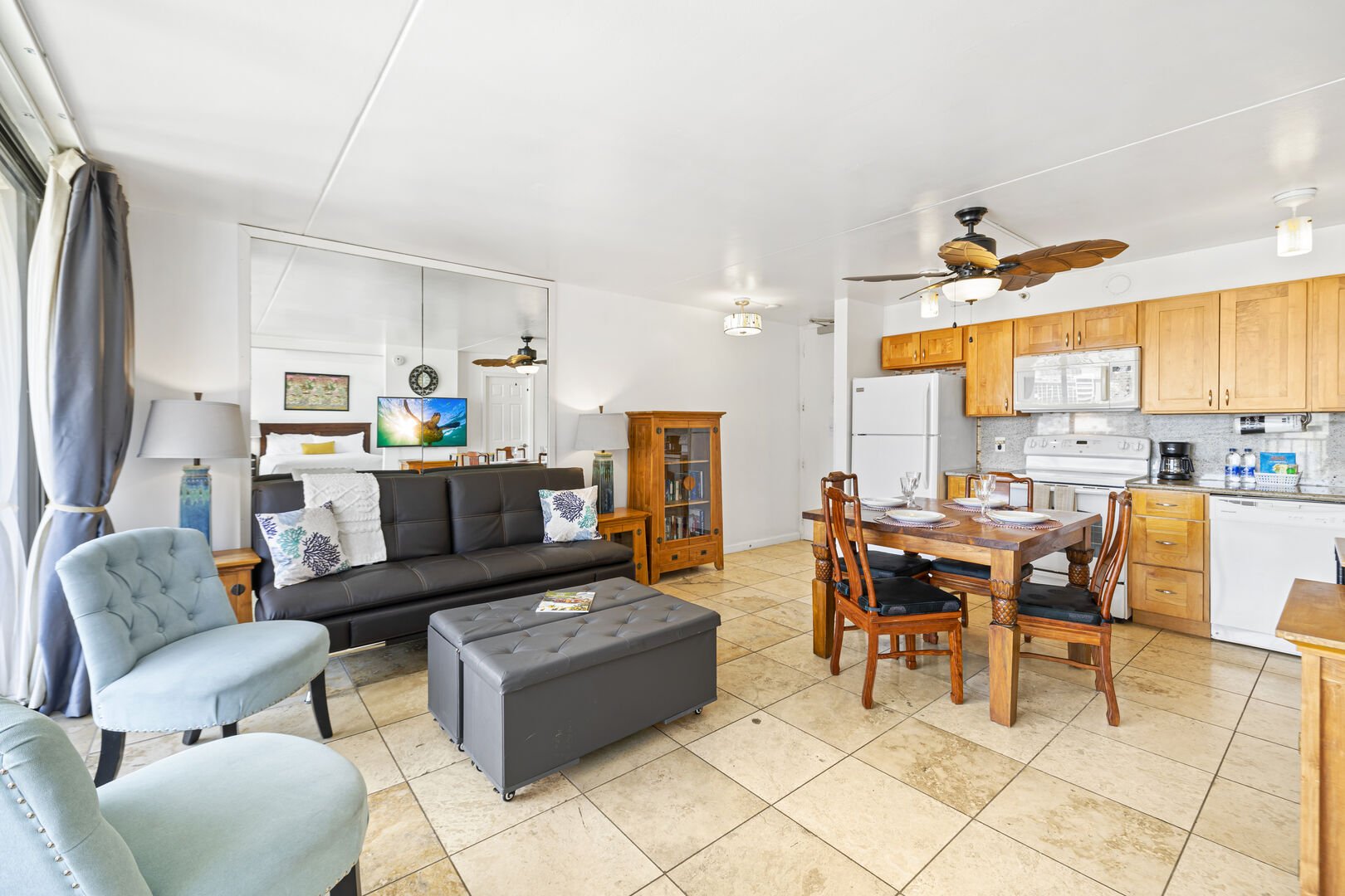 The living and dining area has a recliner sofa (for 1 person only), 2 chairs, a coffee table, and a dining table that can accommodate up to 4 guests!