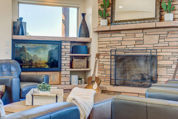 Living Room with Comfortable Leather Chairs, a Gas Fireplace and 43