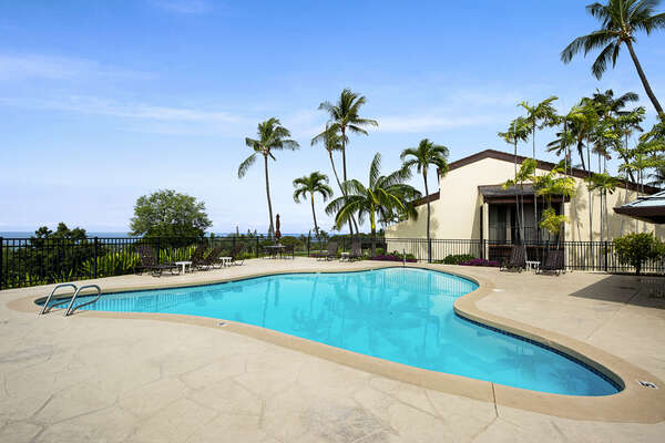 Pool Surrounded by Palm Trees with Ocean Views at Kona Country Club Villa