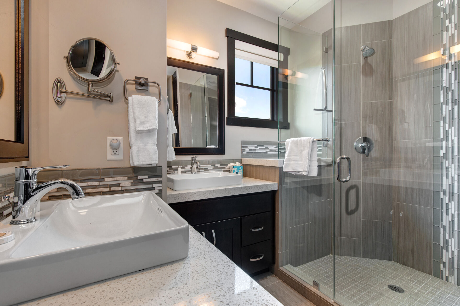 Private Master Bathroom with two separate vanities, and over-sized tile shower