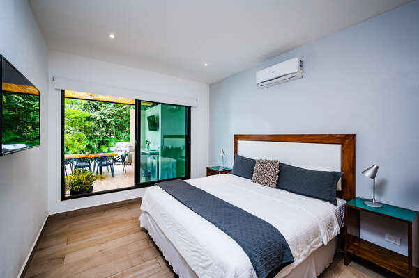 Master Bedroom 3, with pool view and access, can be configured as two single or a king-size bed