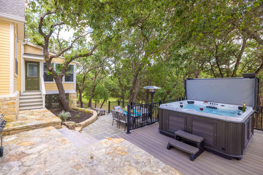 Back yard has heated plus plus big hot tub and multi-decks with outdoor dining and fire pits too