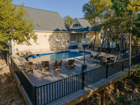 Terrific sky deck with lots of lounge seating, fire pit, heated pool and hot tub too.