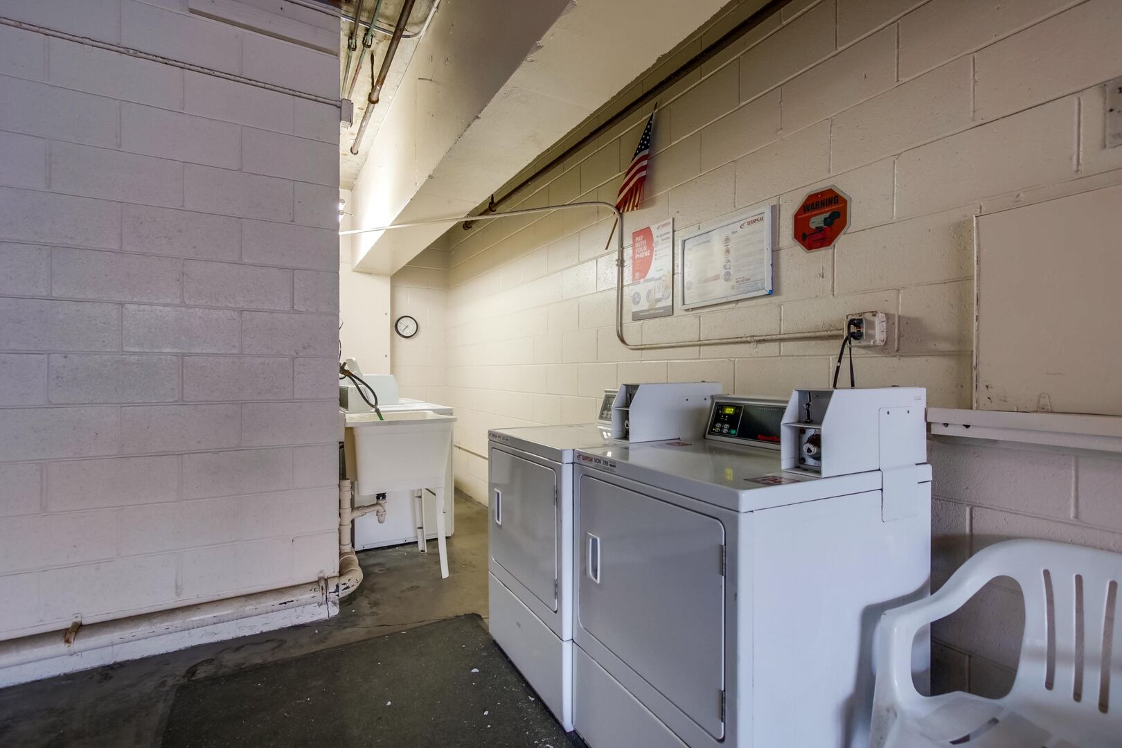 Shared coin operated laundry in parking garage