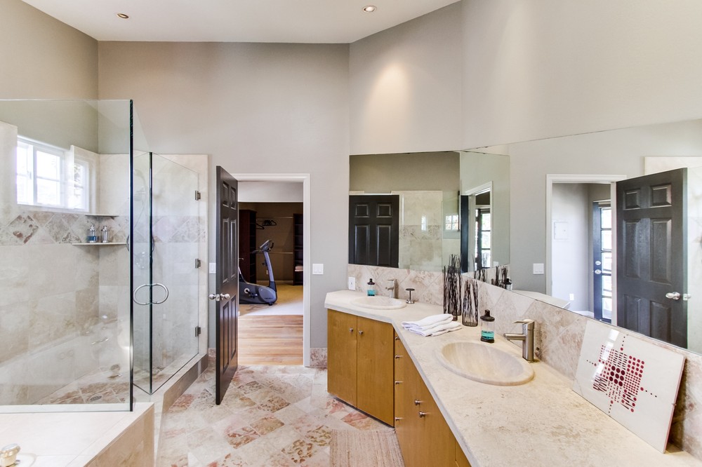 Large master ensuite bathroom with vanity sinks, shower, soaking tub