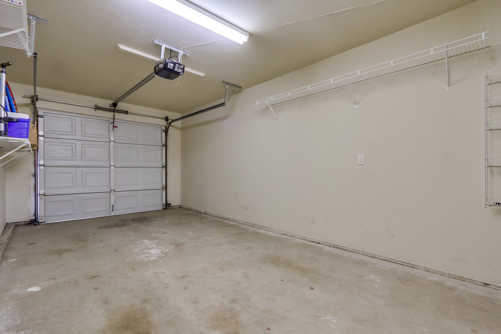 Garage with storage and parking for 1 vehicle and driveway parking for 1 vehicle