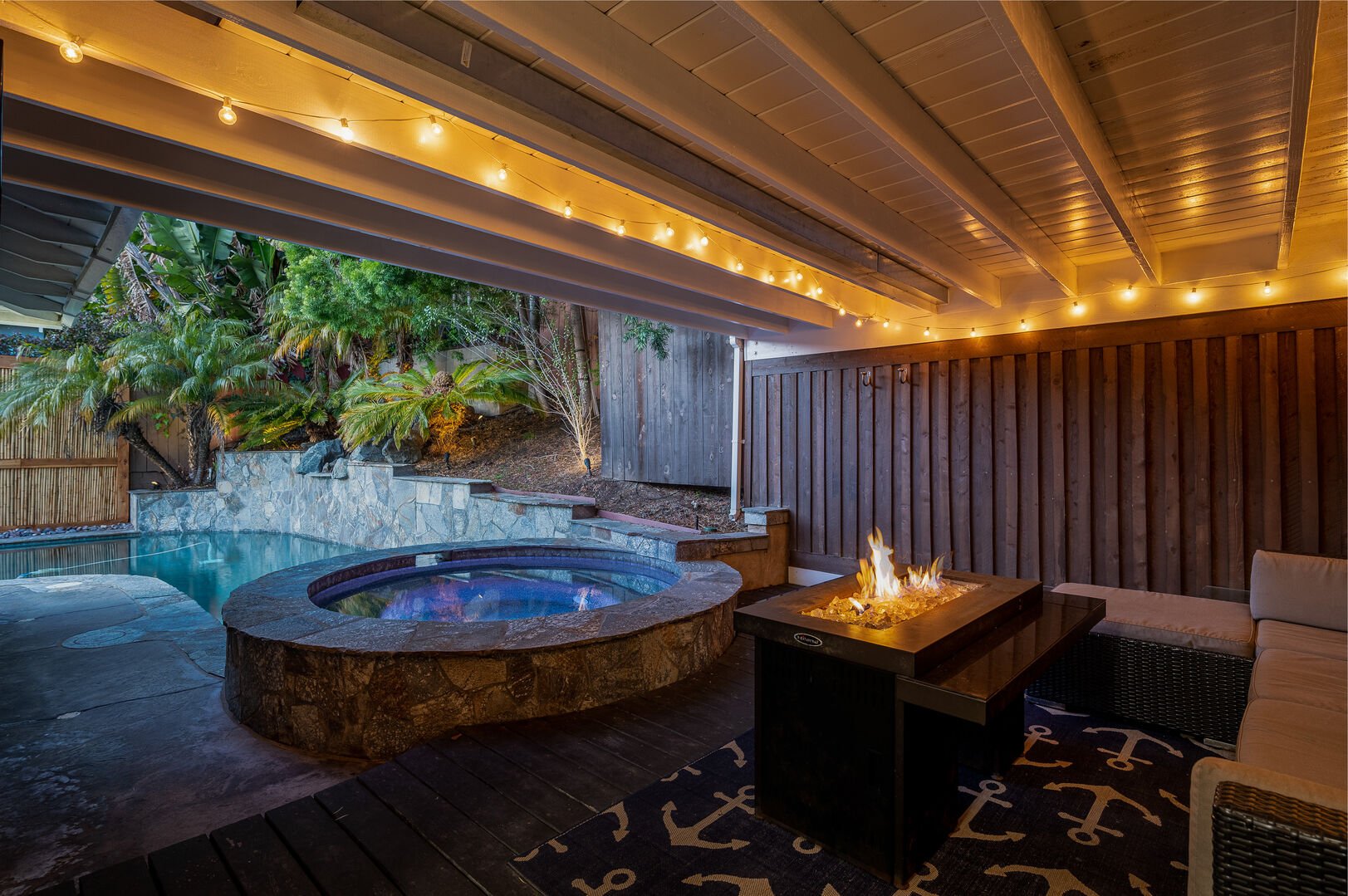 Hot tub next to the pool and fire pit - great spot to unwind after a fun day out!