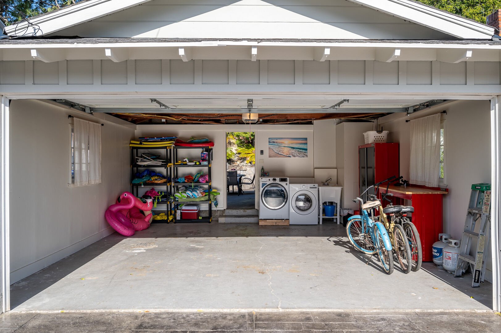 Garage accessible for guest vehicles (two small or one large), including a full size washer and dryer, beach accessories and beach cruisers!
