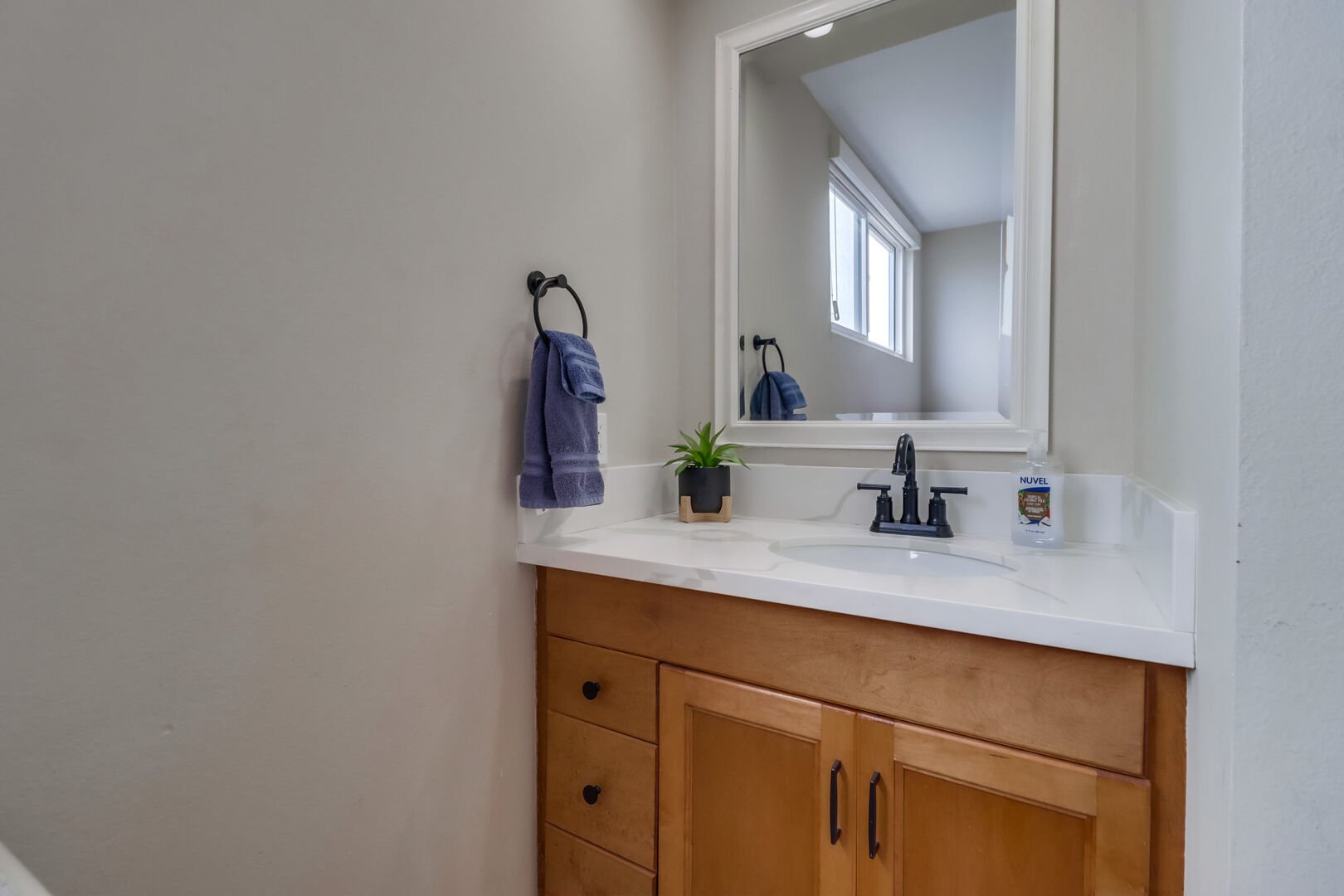 Small vanity, sink and storage in the guest bedroom