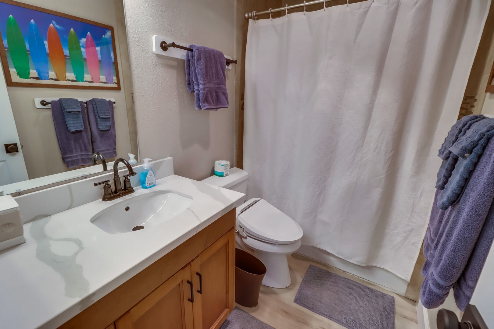 Shared full bathroom with shower-tub combo