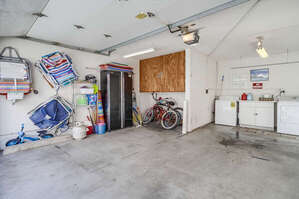Garage parking for 2 SMALL cars with washer and dryer and beach accessories including chairs, boogie boards and beach umbrella. Bikes and extra propane also provided. 1 LARGE VEHICLE FITS COMFORTABLY