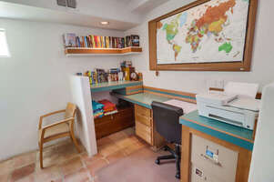 Downstairs laundry room and office with desk, chair, printer for guest use, and washer and dryer