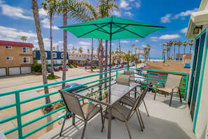 Private patio on the second level with dining table for 6 guests, BBQ gas grill, and the ocean view!