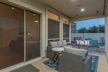 Relax on the covered patio with comfortable seating and a porch swing.
