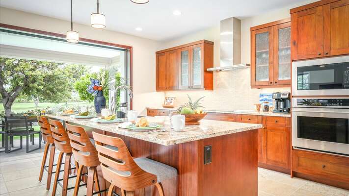 The large “Chefs” kitchen includes an expansive granite island that seats 4-6 people