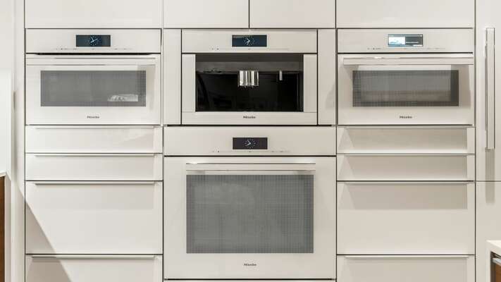 Miele appliances are secreted away in the kitchen