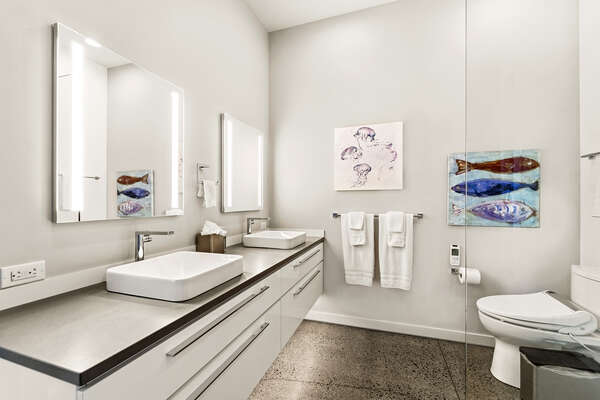 Ocean-inspired full en-suite bathroom with Kohler fixtures, BioBidet toilet and full walk-in shower