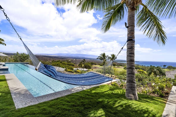 Doze in the spacious poolside hammock, suspended in the tropical breeze over the Pacific with palms swaying overhead