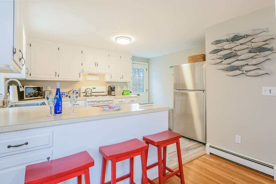 Side entrance into the kitchen , stainless fridge-46 Har-Wood Ave Harwich- Cape Cod- New England Vacation Rentals