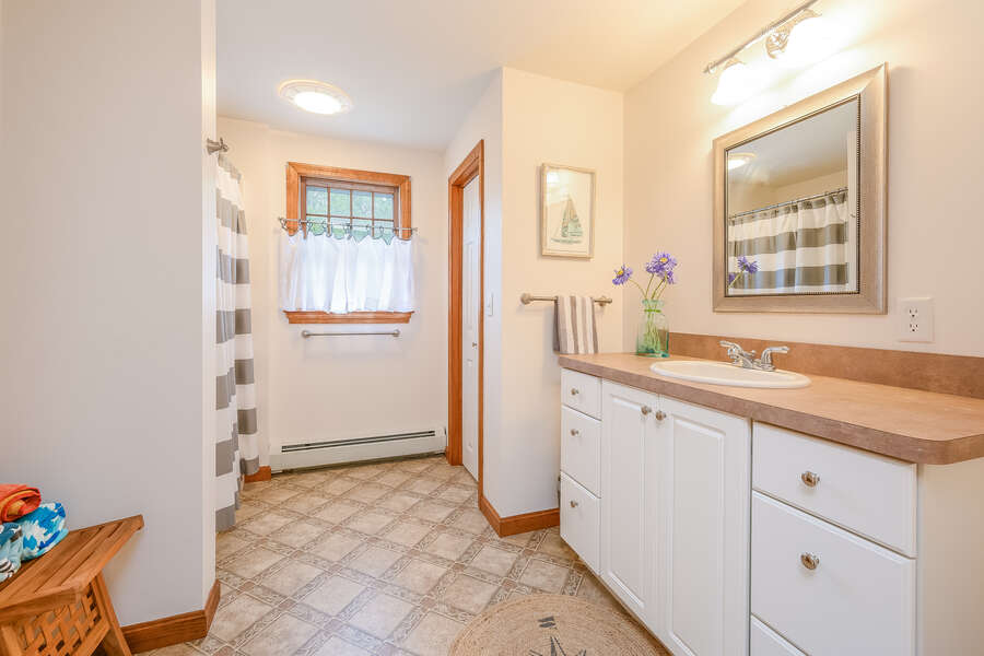 Bathroom #2 Full bath with large vanity, shower/tub combo and linen closet- 46 Har-Wood Ave Harwich- Cape Cod- New England Vacation Rentals