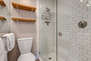 Master Bathroom with large tiled shower and separate wash room