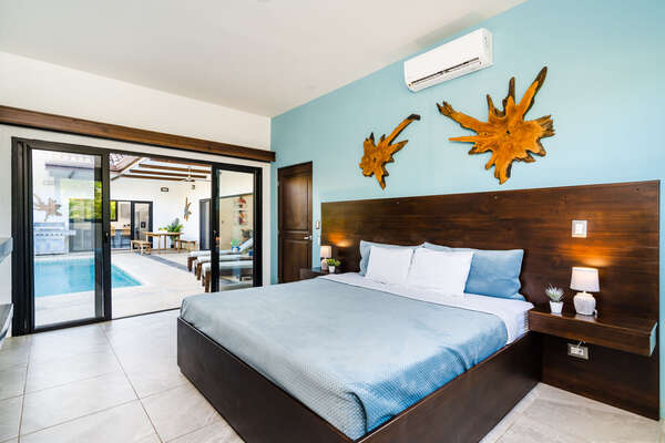 Master Bedroom 1 with One King Bed, in tropical wood, Ensuite Bathroom, Dressing, AC and Pool Access