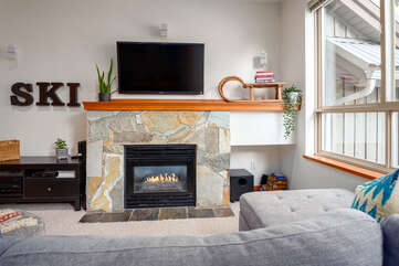 Living area with TV and cozy gas fireplace