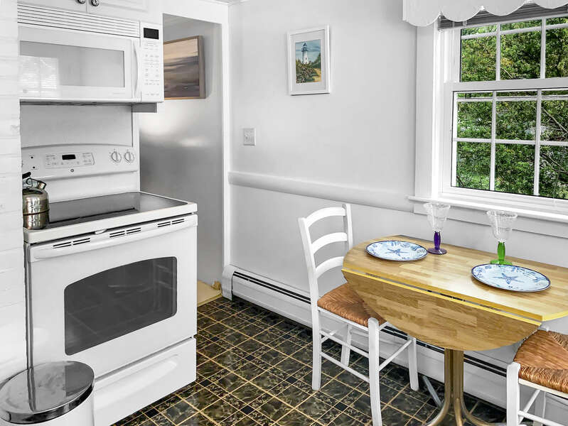 Kitchen with drop leaf table, stove and microwave-25 Zylpha Rd Harwich Port- Cape Cod- New England Vacation Rentals