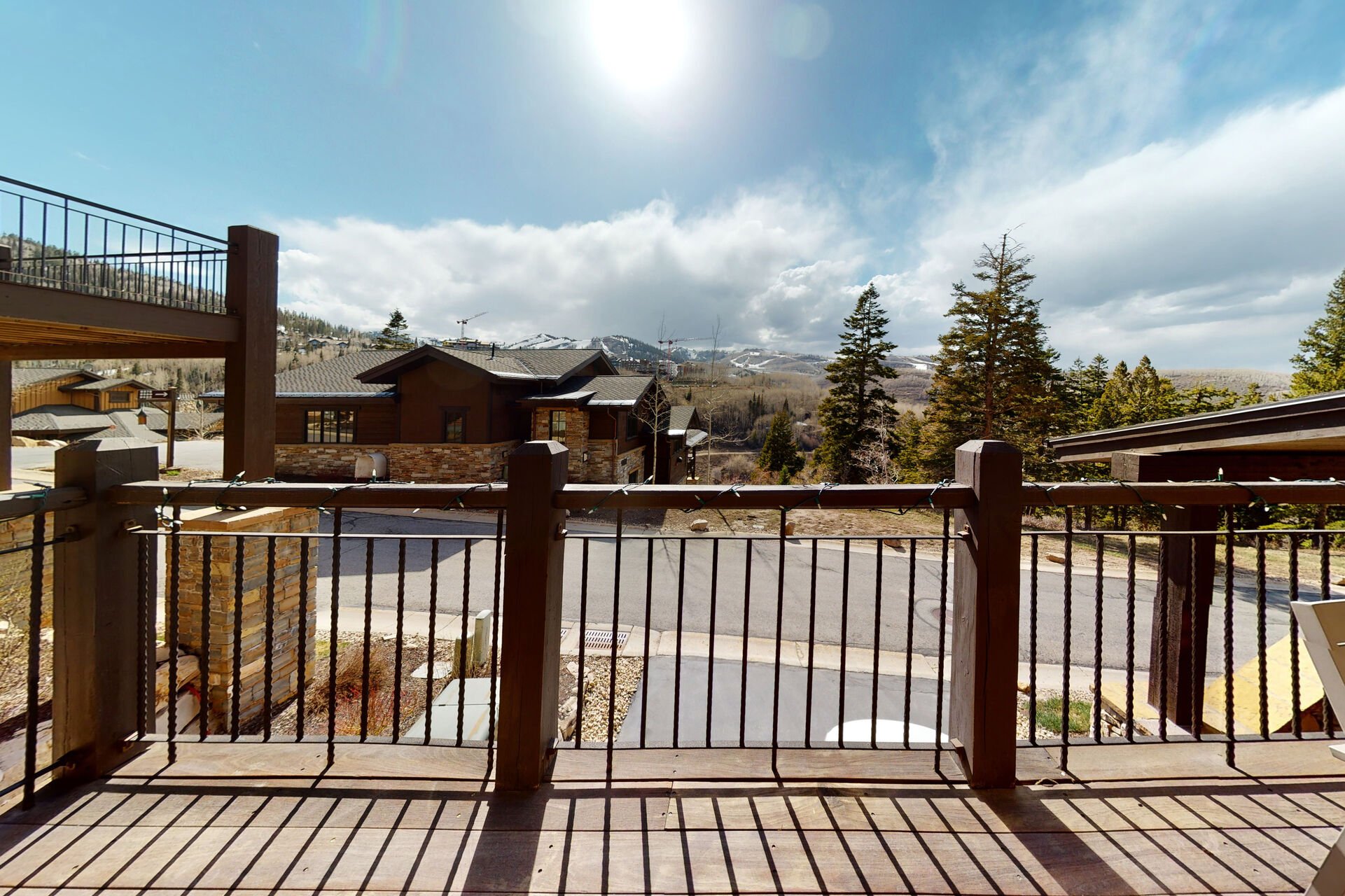 Main Level balcony off of living room with seating for up to 8 and breathtaking mountain views