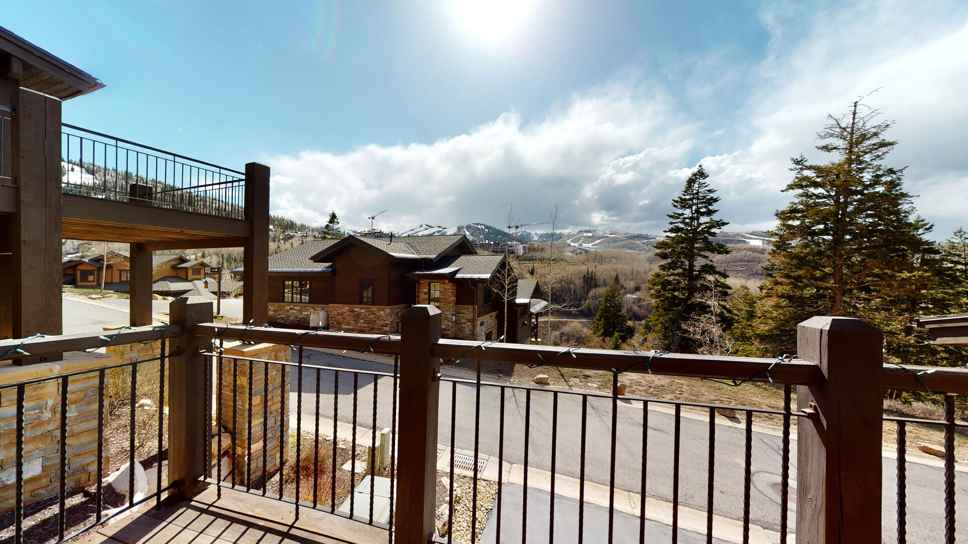 Main Level balcony off of living room with seating for up to 8 and breathtaking mountain views
