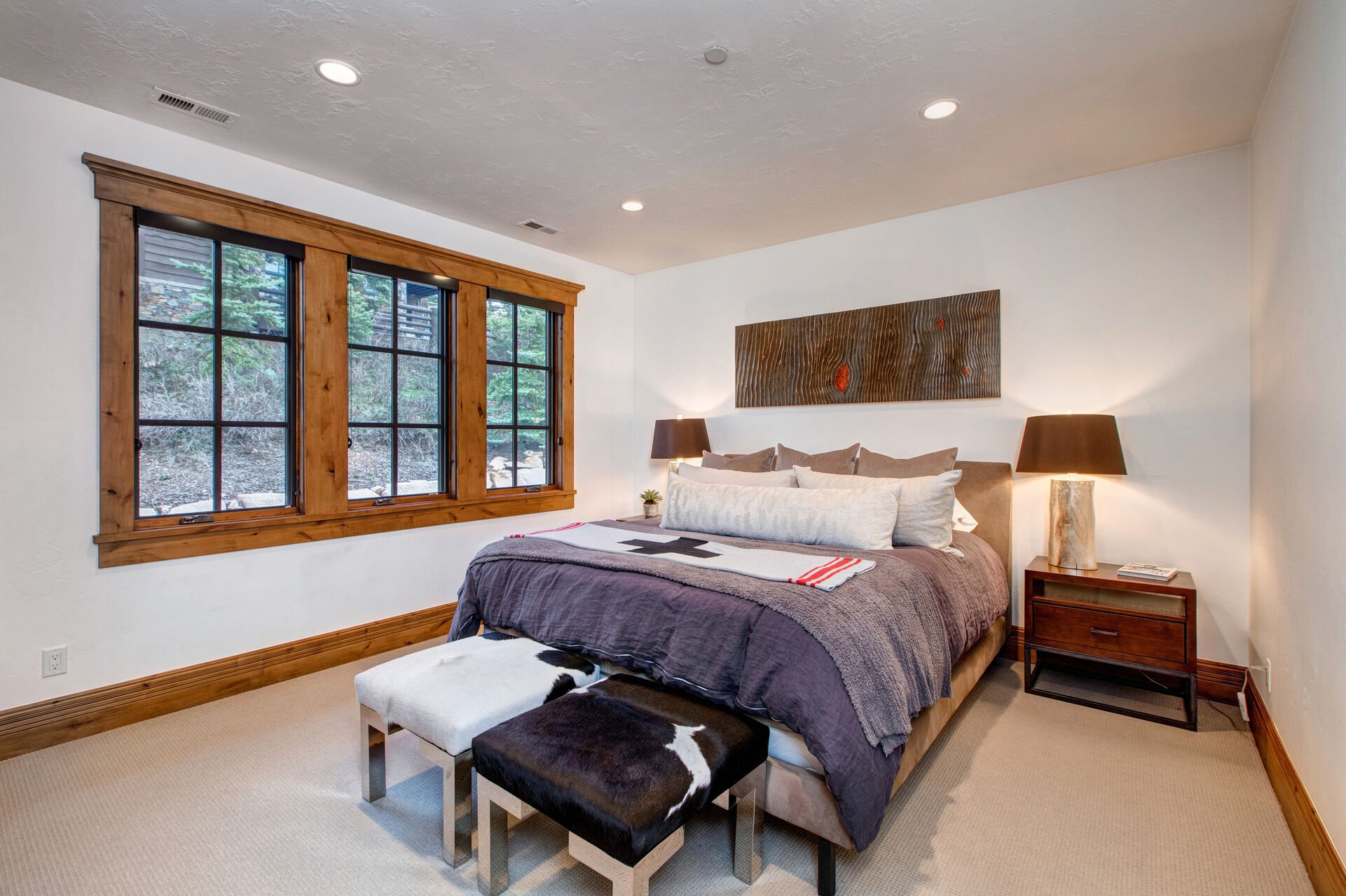 Upper Level Bedroom 3 with king bed, hot tub patio access, and en suite bathroom