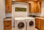 Main Level Private Laundry Room with full-sized washer and dryer