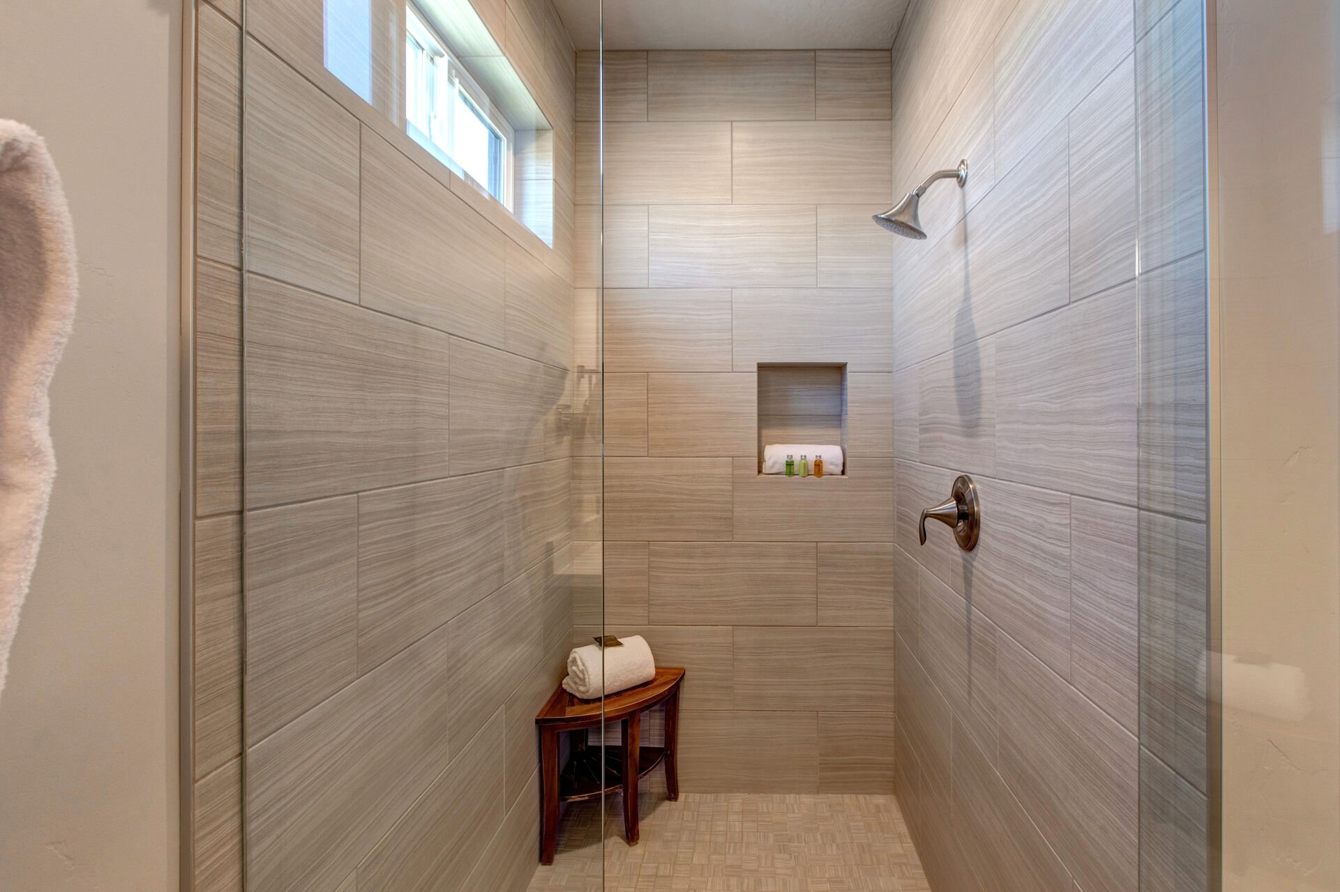 Master Bathroom with double sinks, large soaking tub, over-sized shower with seating, walk-in closet, and separate washroom