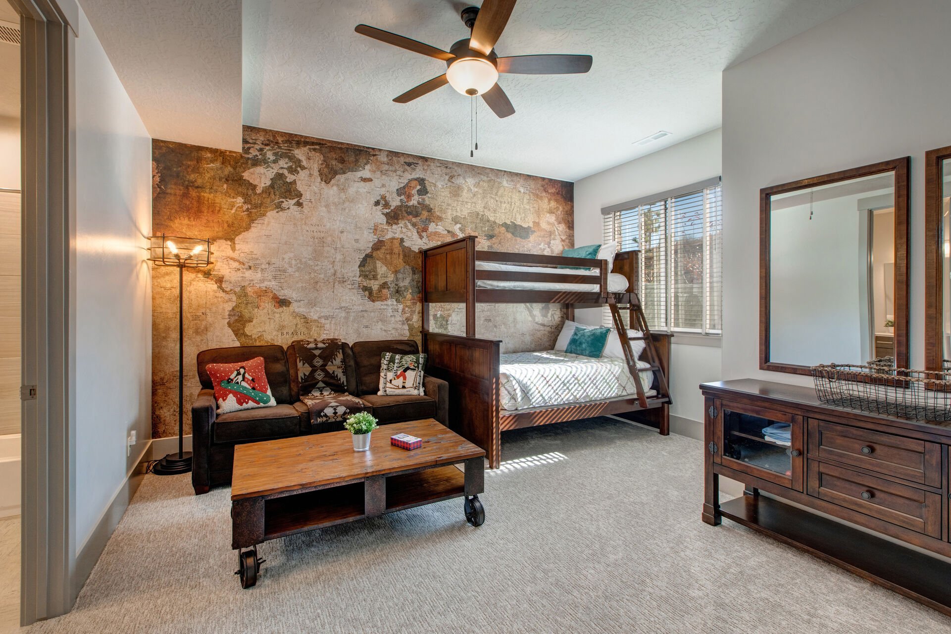 Lower level bedroom 4 with twin over full bunkbed, sofa-sleeper, smart TV, and en suite bathroom