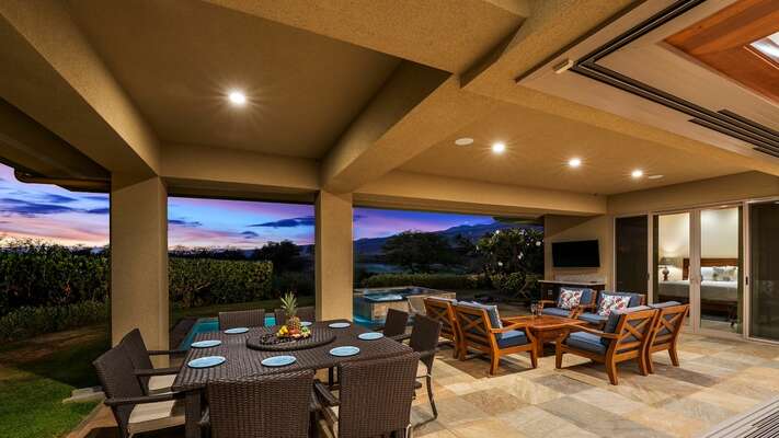 expansive lanai, complete with a dining table, and large seating area
