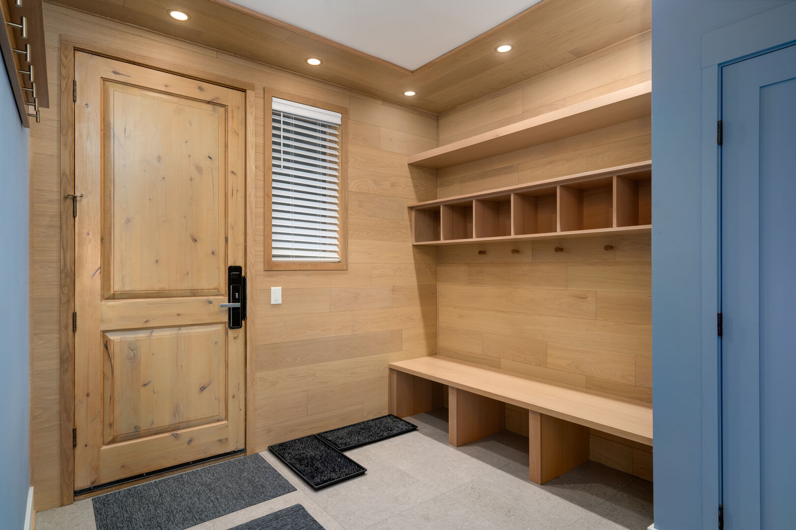 The entry mudroom, cubbies, coat racks and closet have more than enough storage.
