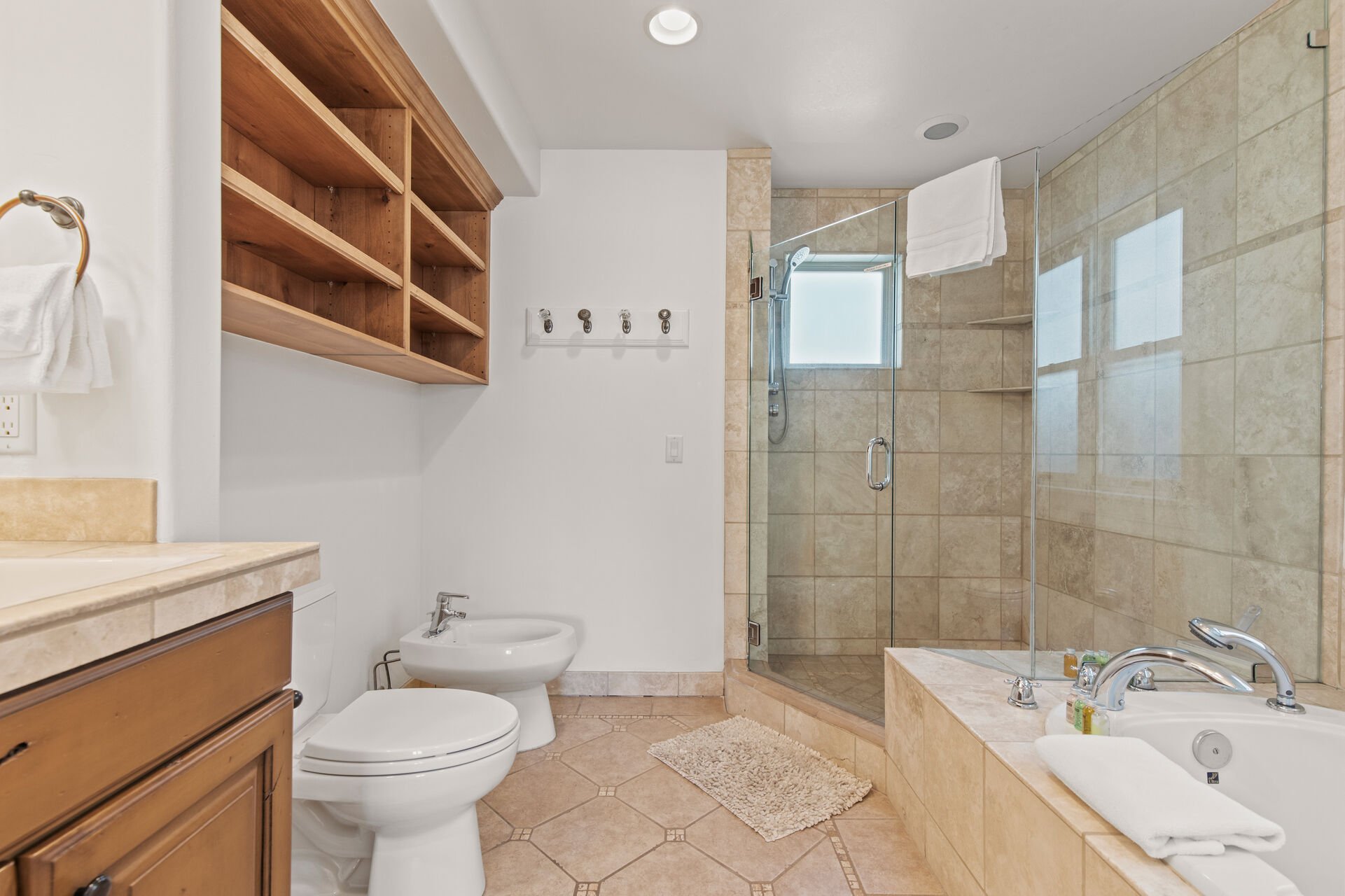 Master Bathroom with over-sized tile shower, jetted tub, and dual vanities