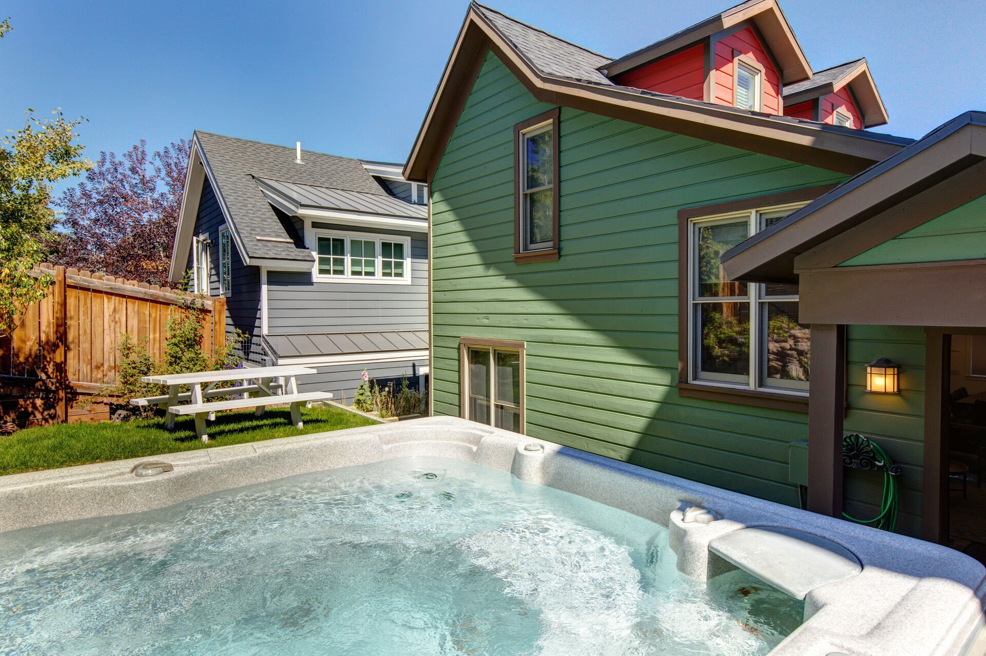 Private back yard with hot tub, and picnic table dining for four