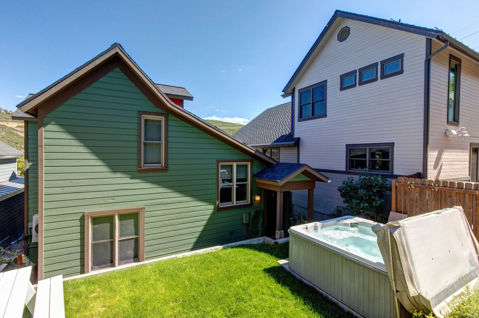 Private back yard with hot tub, and picnic table dining for four