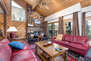Living Room with plush leather furnishings, loft access, wood-burning fireplace, 45
