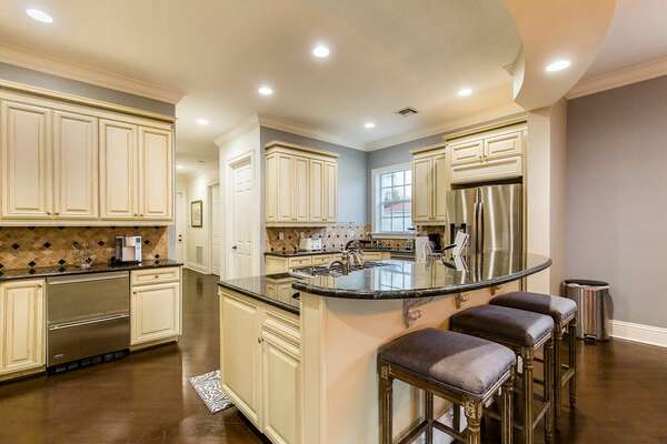 Sit at the breakfast bar and eat your breakfast in this large open kitchen