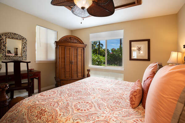 Master Bedroom with Views of Palm Trees Outside at Golf Villas at Mauna Lani Q2