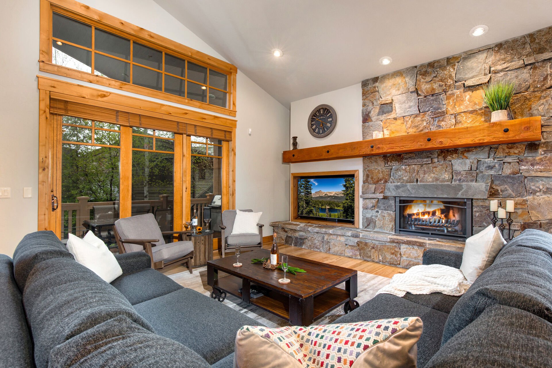 Cozy Living Room with a Gas Fireplace, Sectional Sofa, Smart TV and Balcony