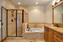 Master Bath Offering a Jetted Tub and Separate Shower