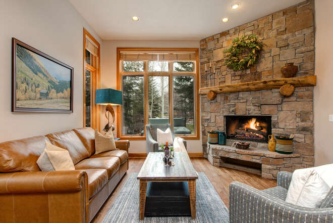 Living Room with plush leather furnishings, large, bright windows, brand new gas fireplace, and 55
