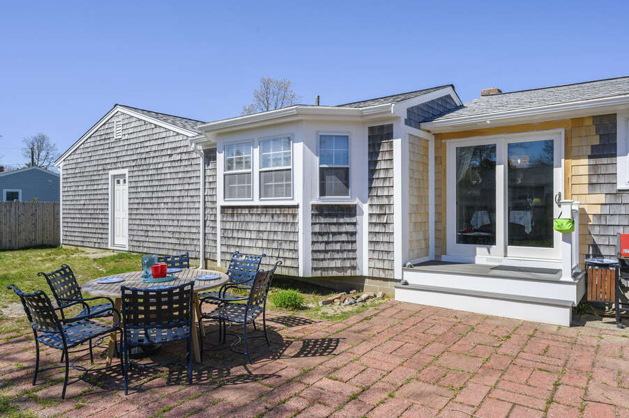 Kitchen / dining room sliders lead to outdoor area - 7 Cutter Lane West Yarmouth Cape Cod - New England Vacation Rentals