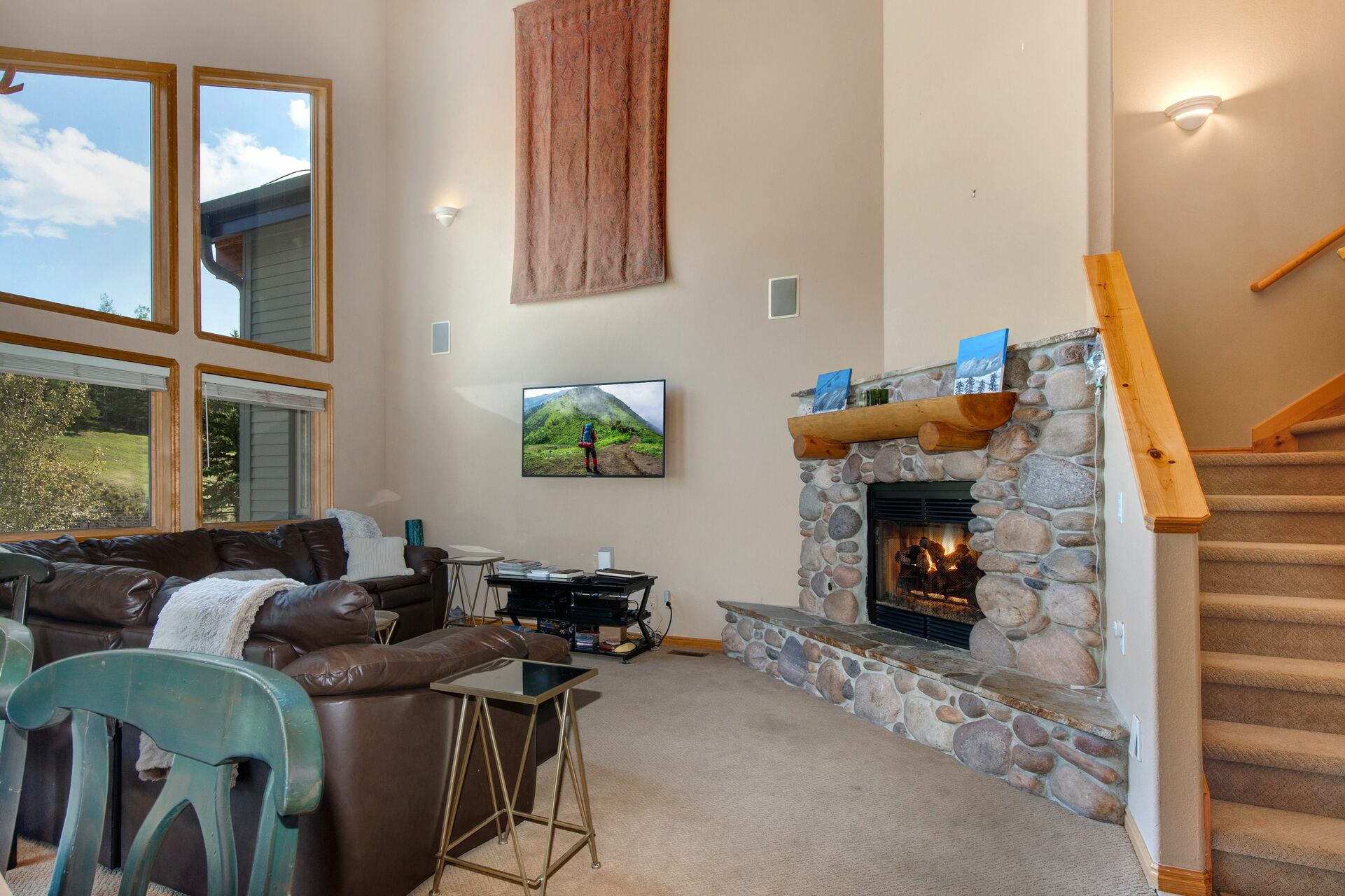 Living Room with gas fireplace and TV