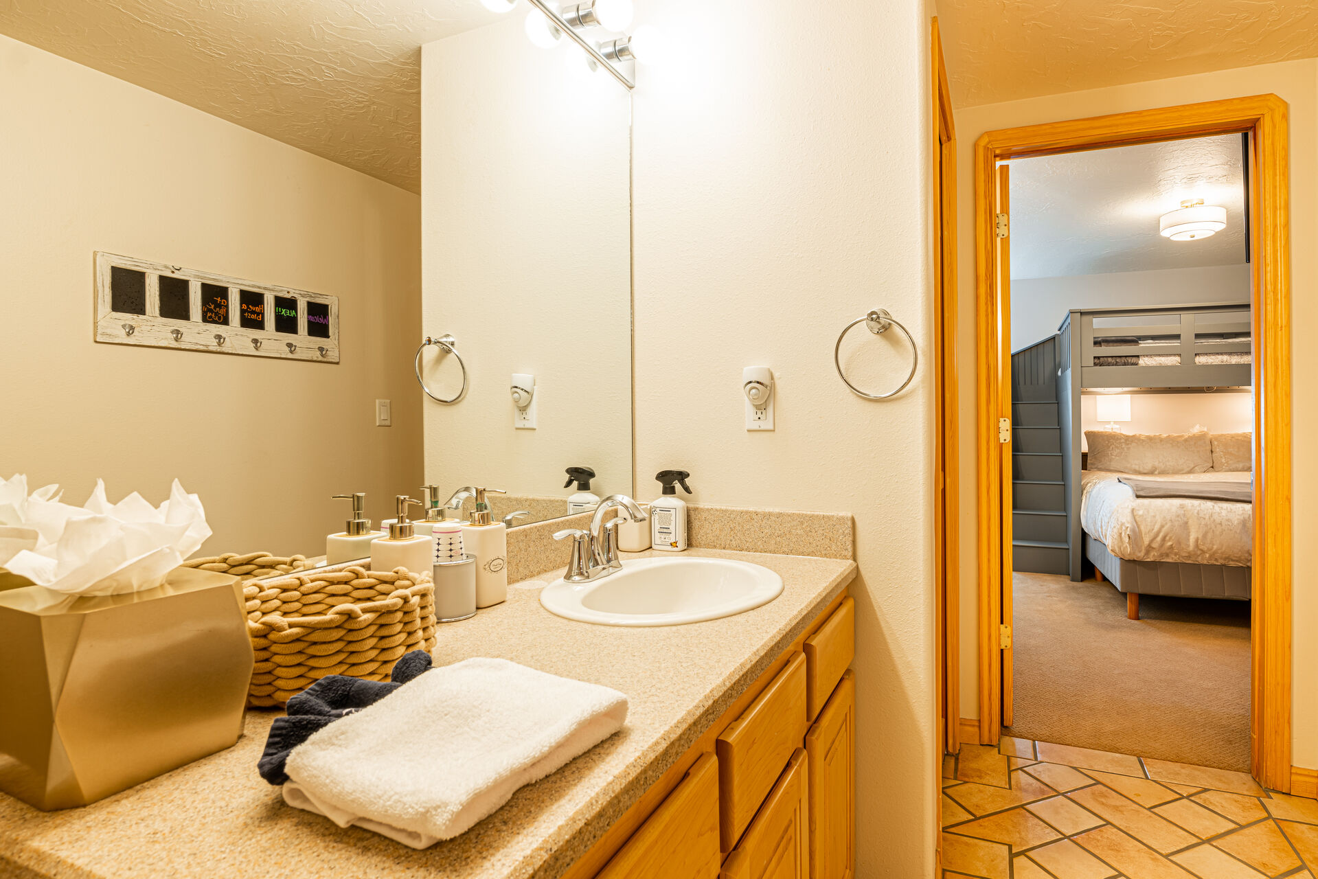 Bedroom 3: The private bathroom has shared Jack-n-Jill access and offers a tub/shower combo.